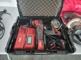 a tool box with tools in it sitting on a table