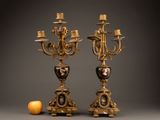 pair of antique brass candelabs with pictures of people on them