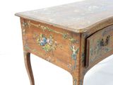 a small wooden table with a drawer on top of it