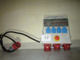 a small electrical box with wires attached to it