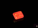 an image of a glowing red diamond in the dark