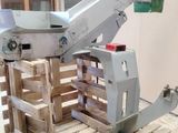 a machine that is sitting on a pallet in a warehouse