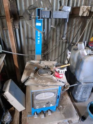 a small stove in the middle of a room with a lot of junk