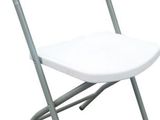 white plastic folding chair against a white background