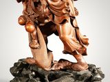 an image of a statue of a man with a staff