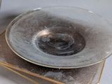 two plates and a bowl sitting on a table