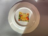 a plate with a label on it sitting on a table