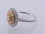 a close up of a diamond ring on a white surface