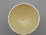 bowl on a gray surface with a white background