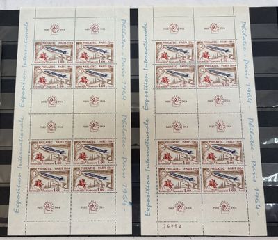 two stamps with a picture of a plane on them on a table