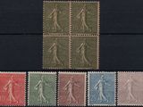 a close up of a group of stamps on a black surface