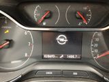a close up of a car dashboard with various gauges and numbers