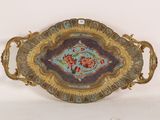 a decorative tray with flowers on it on a white surface