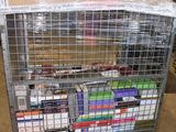 a metal cart with many books on it in a warehouse