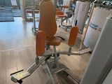 a gym room with a row of machines in it