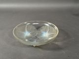 a glass bowl that has a flower inside of it