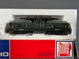 a toy train that is in a box on a table