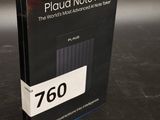 a close up of a book on a table with a black background