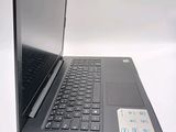 a laptop computer sitting on top of a white table