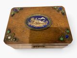 a wooden box with a blue and gold design on it