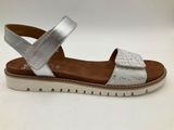 a close up of a silver sandals on a white background