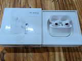 an apple airpods are sitting in a box on a wooden floor