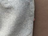 someone is wearing a pair of blue jeans with a red button