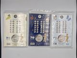 four different types of coins are in plastic bags on a table