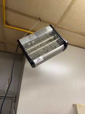 a heater hanging from the ceiling in a room