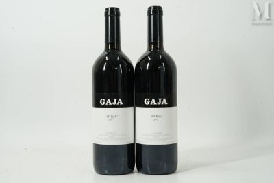 two bottles of wine that are sitting on a table