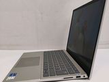 a laptop that is sitting on a white table