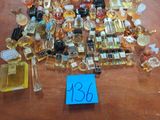 a lot of perfume bottles on a table with a price tag