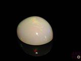 an image of a white oplite on a black surface
