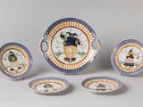 several plates and bowls with designs on them on a white surface