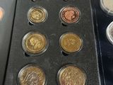 a lot of coins that are sitting on a table