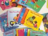 many children ' s books that are on the table