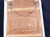 a picture of a wooden easel with a painting on it