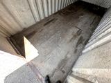 a person standing on the stairs of a building