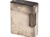 an old silver lighter with a black stripe pattern on it