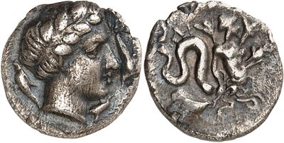 a silver coin with an image of a woman and a snake on it
