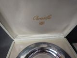 a silver plate in a box with a name on it