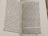 someone is holding a book open to a page with a picture on it