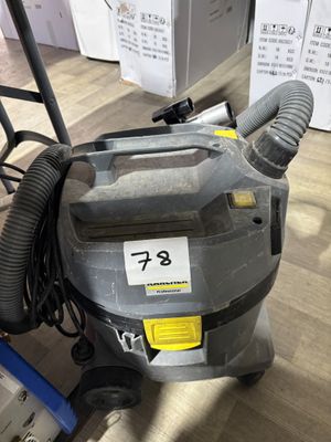 a vacuum that is sitting on the floor in the room