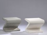 pair of concrete stools in the shape of a zigzag