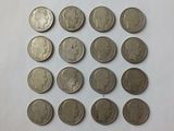 a close up of a bunch of coins sitting on top of a table
