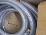 a blue hose that is in a box on the floor