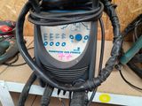a small air compressor sitting on top of a pallet