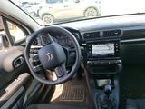 dashboard view of a car with a steering wheel and dashboard controls