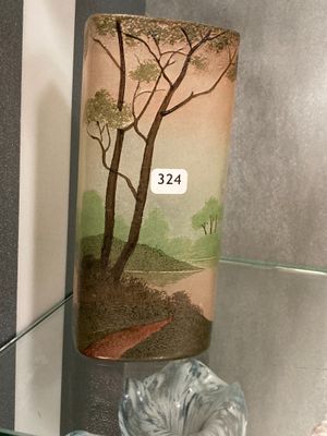 two vases on display on a glass shelf in a glass case