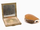 a compact mirror and a compact case on a white surface